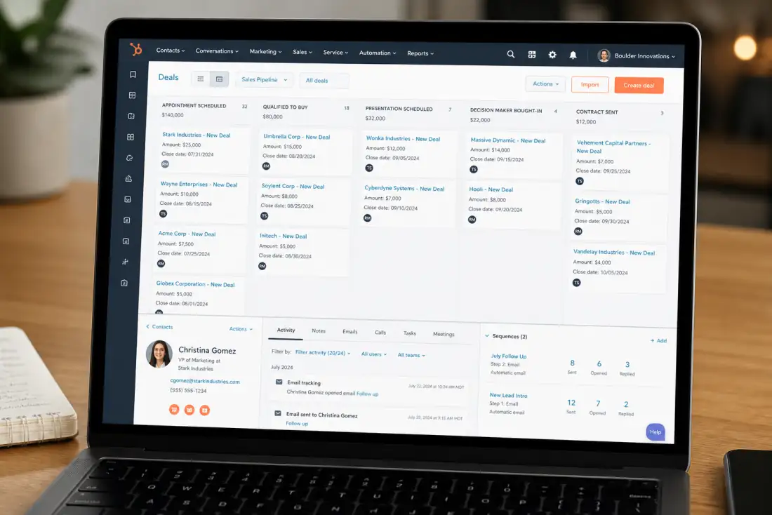 Laptop showing a HubSpot CRM pipeline, contacts, and email sequences
